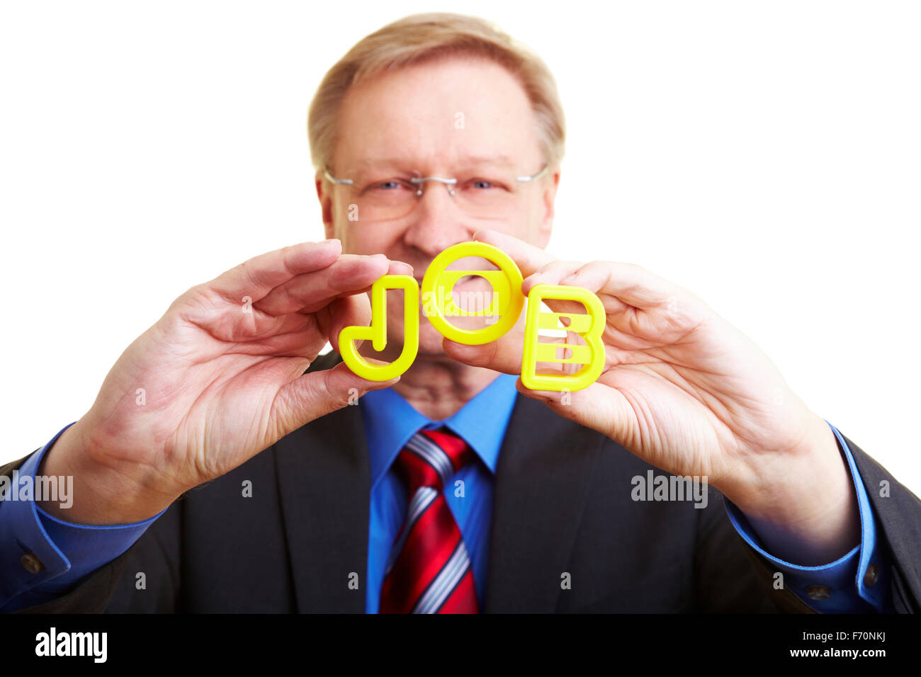 Senior businessman holding letters forming the word JOB Stock Photo