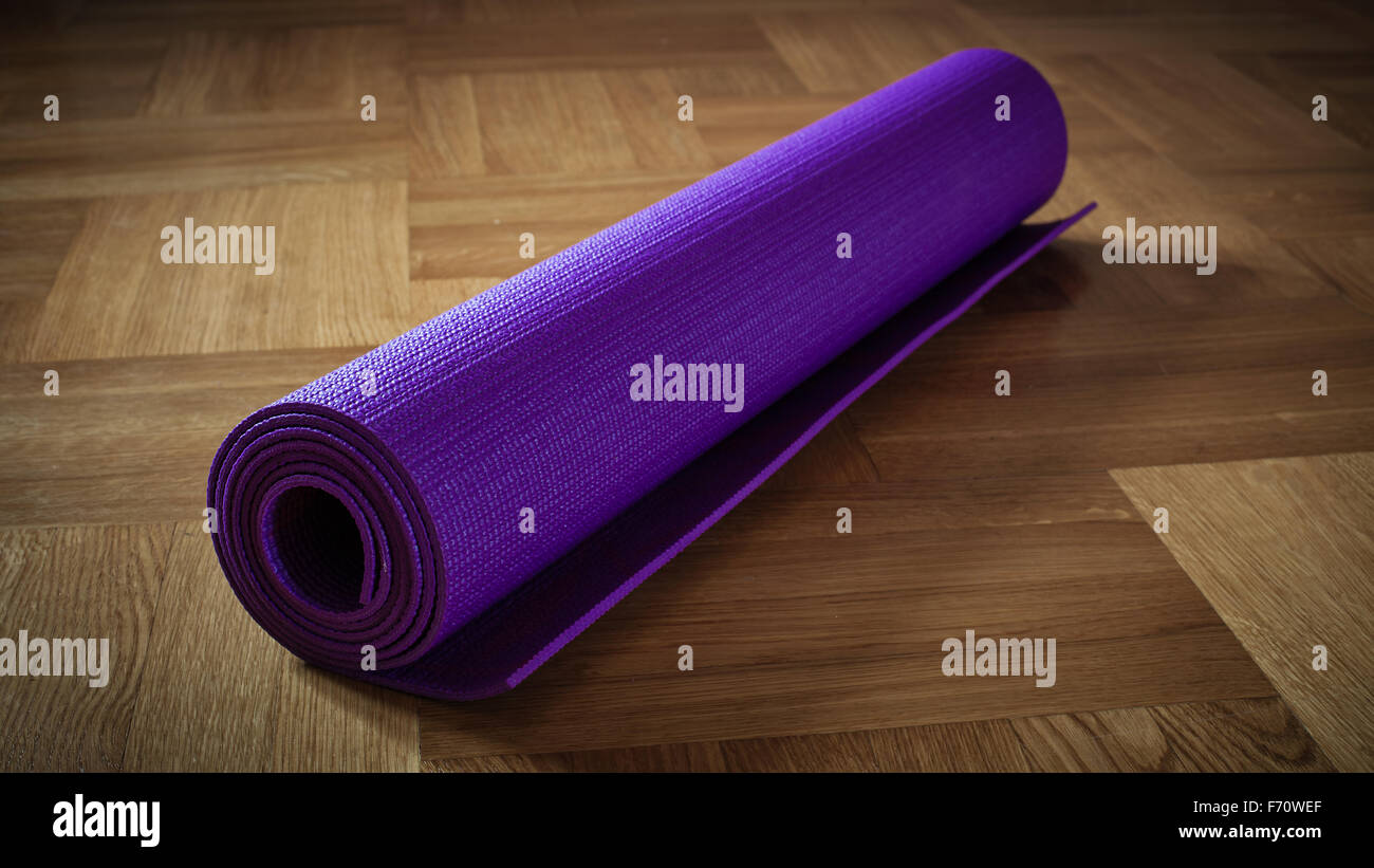 Yoga mat on floor Stock Photo