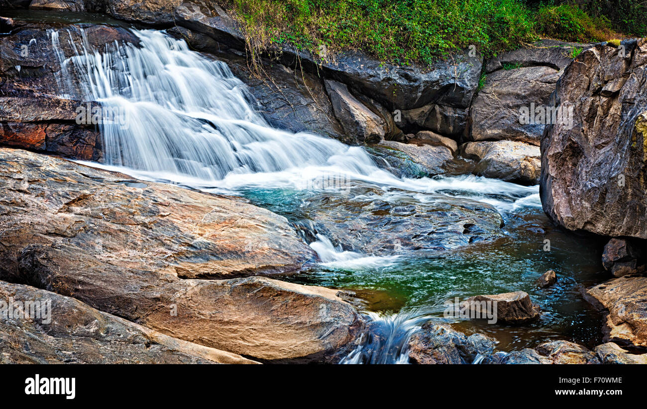 Small tropical waterfall Stock Photo