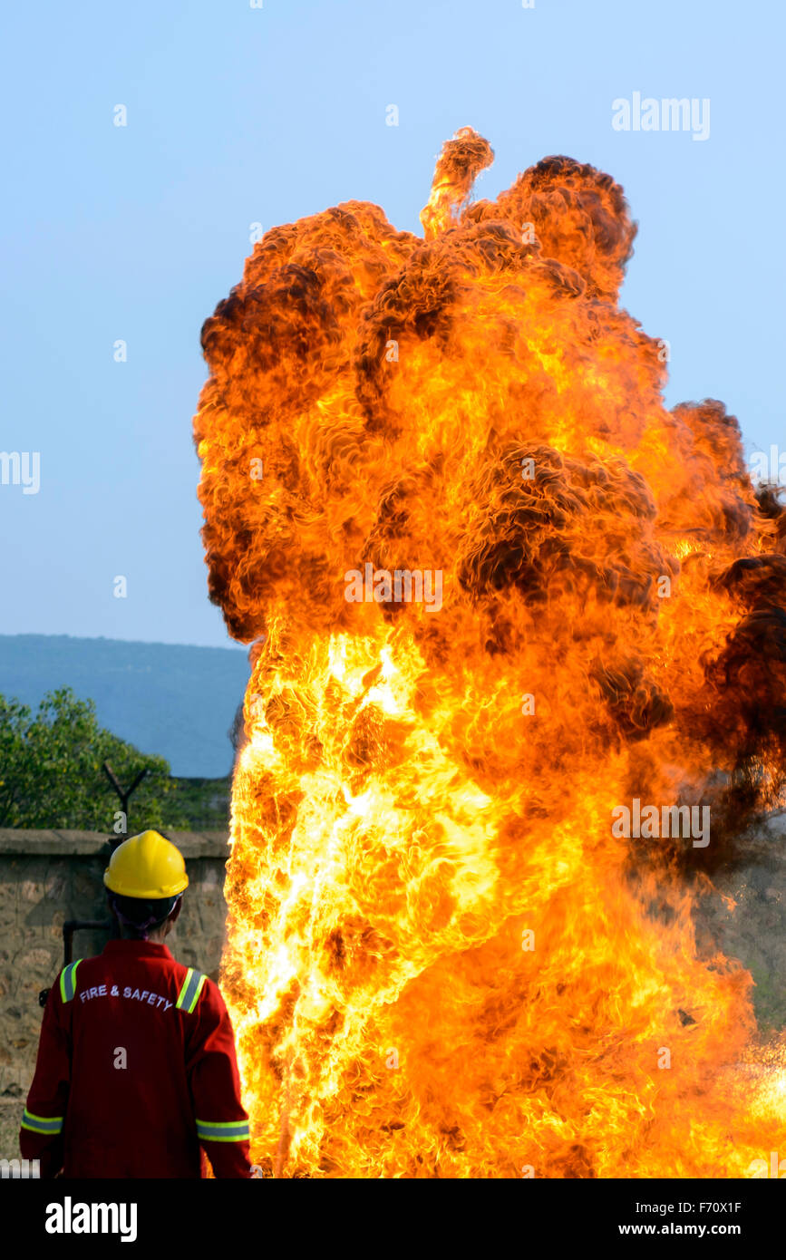 Fire fighter fighting flame, visakhapatnam, andhra pradesh, india, asia Stock Photo