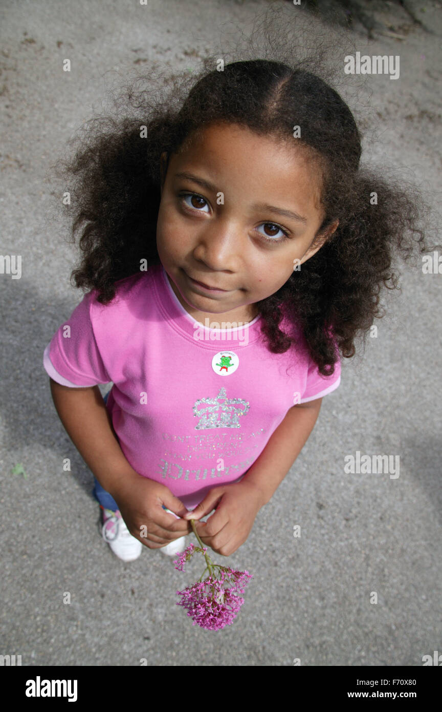 High View Of Young Girl With Her Hair In Bunches Stock Photo