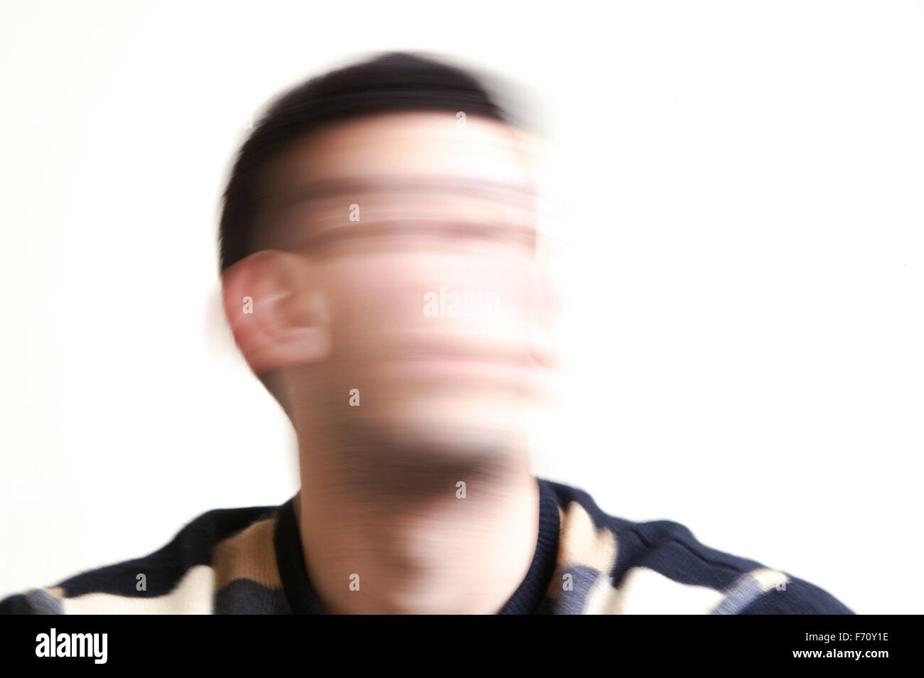 Blurred portrait of a young man; model released for use in HIV and Aids ...