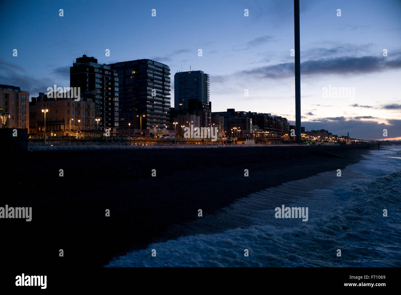 Brighton seafront and hotels, before sunrise, streetlights and i360 viewing tower Stock Photo