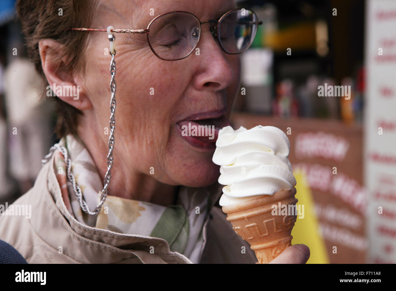 Portrait of Elderly woman eating an ice cream Stock Photo Alamy