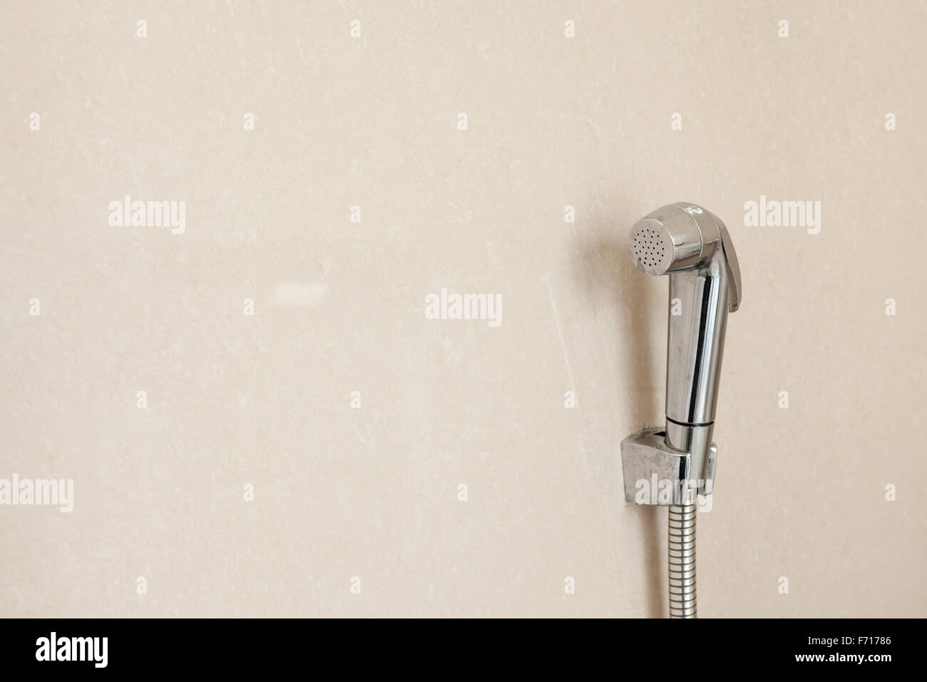 on the wall hangs a Bidet Toilet Water spray or an toilet nozzle Stock Photo