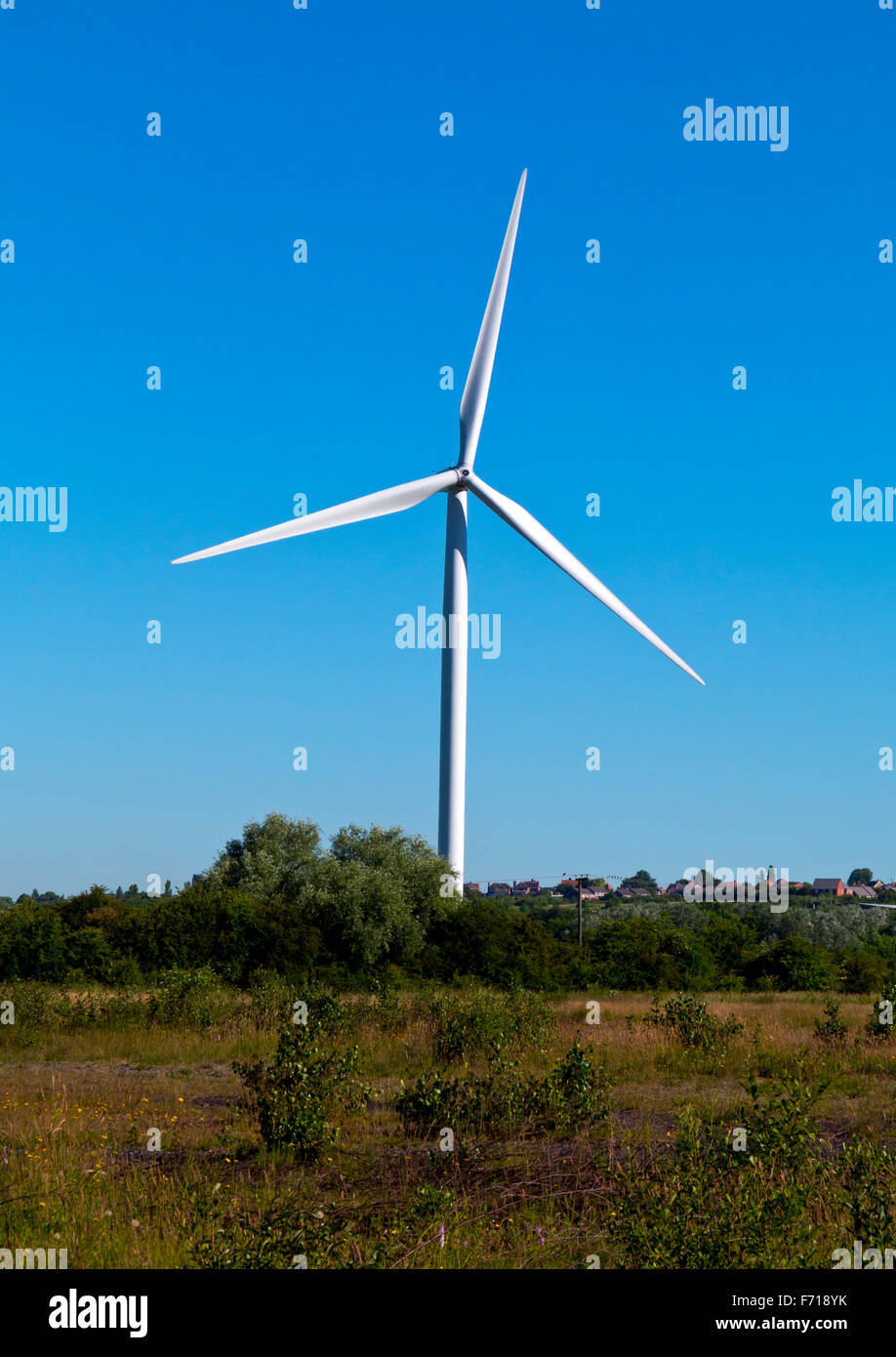 Wind turbine photographed in summer with blue sky behind Stock Photo ...