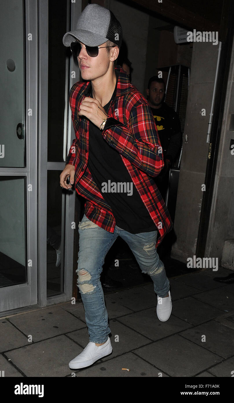 Justin Bieber attempts to evade snappers by sprinting to his car as he  leaves Tape nightclub at 7am hiding his face behind a pair of sunglasses  Featuring: Justin Bieber Where: London, United