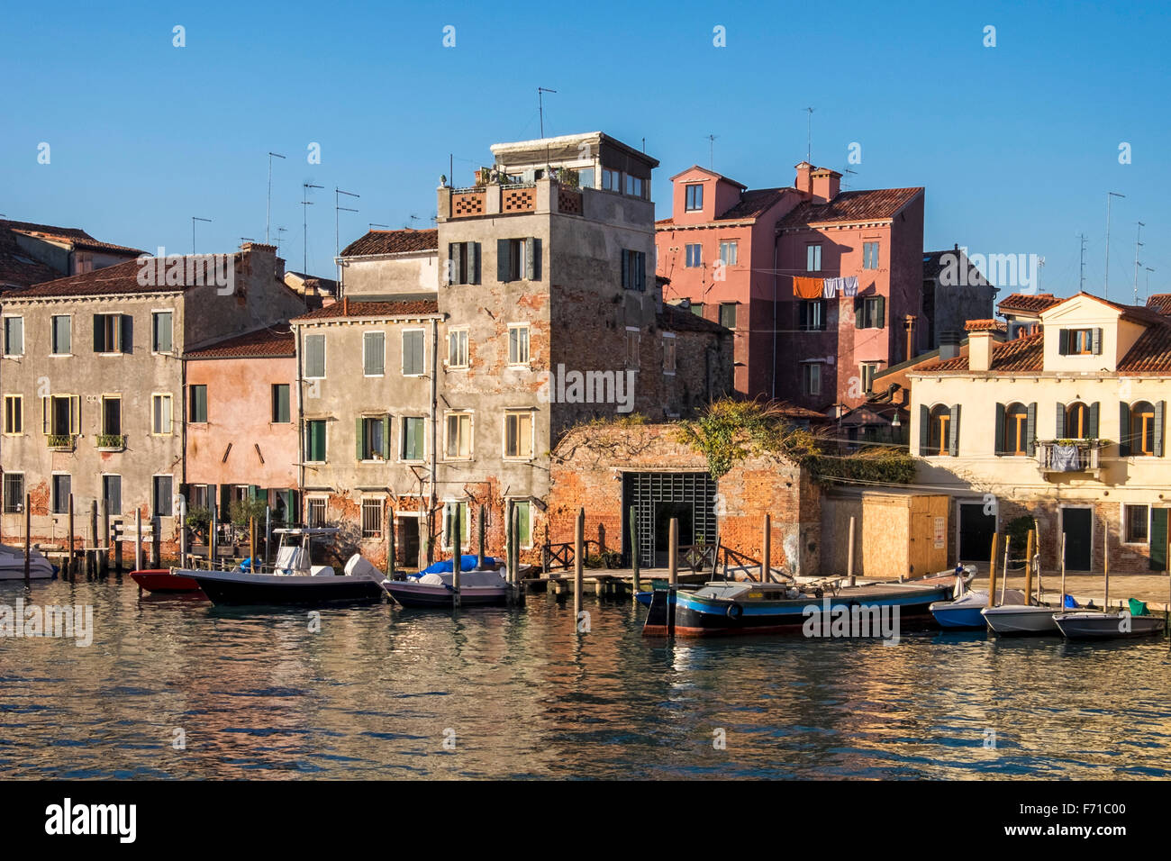 Venice, Castello, Sestiere, Italy Harbour view weathered houses