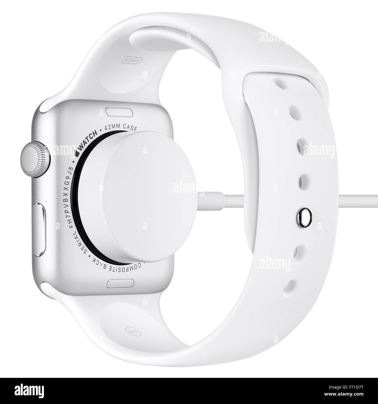 Varna, Bulgaria - October 16, 2015: Charging of Apple Watch Sport 42mm Silver Aluminum Case with White Sport Band. Back view. Stock Photo