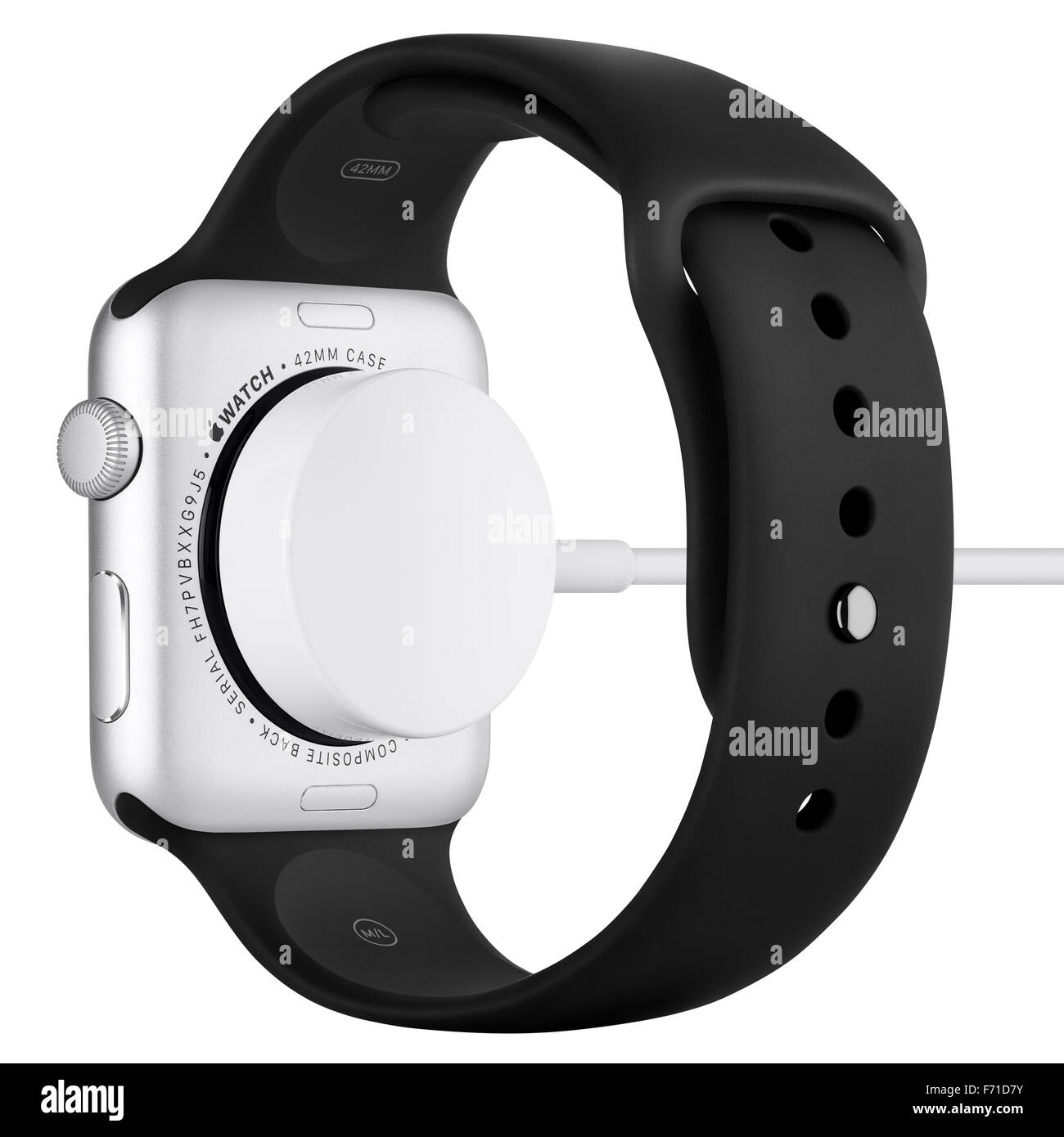 Varna, Bulgaria - October 16, 2015: Charging of Apple Watch Sport 42mm Silver Aluminum Case with Black Sport Band. Back view. Stock Photo