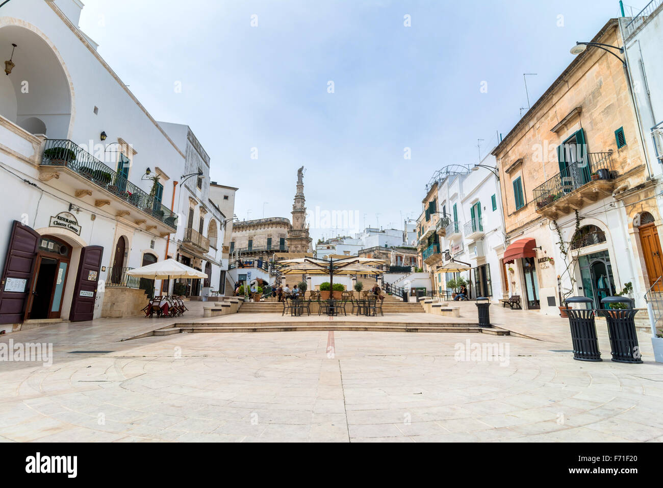 old town and Statue of San Oronzo in Ostuni, Italy Stock Photo