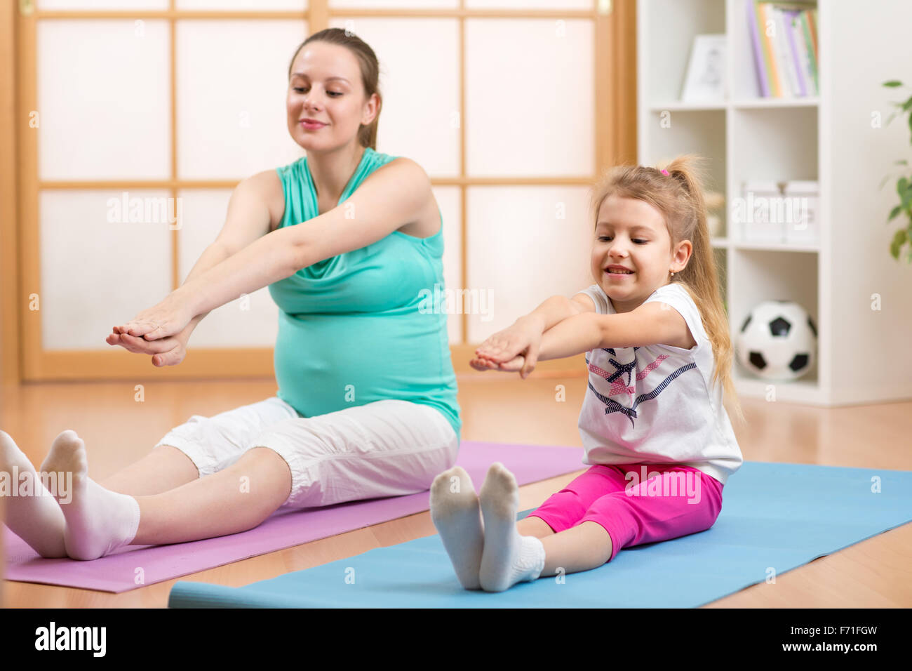 Pregnant woman with her first child doing gymnastics Stock Photo Alamy