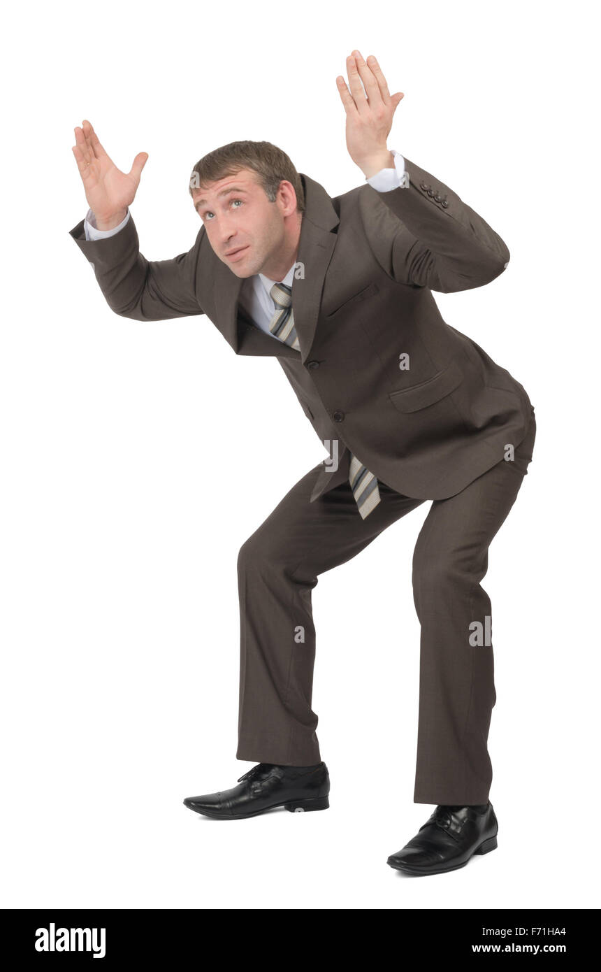 Businessman under heavy empty space Stock Photo - Alamy
