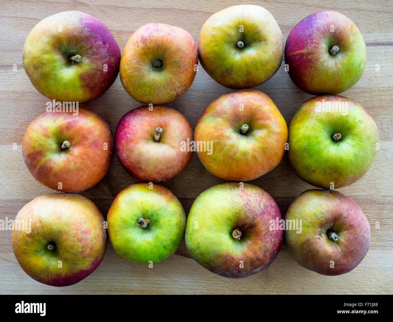 12 fresh apples in 3 rows Stock Photo