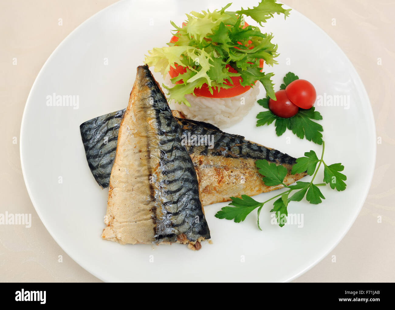 Baked mackerel with rice under vegetables Stock Photo Alamy