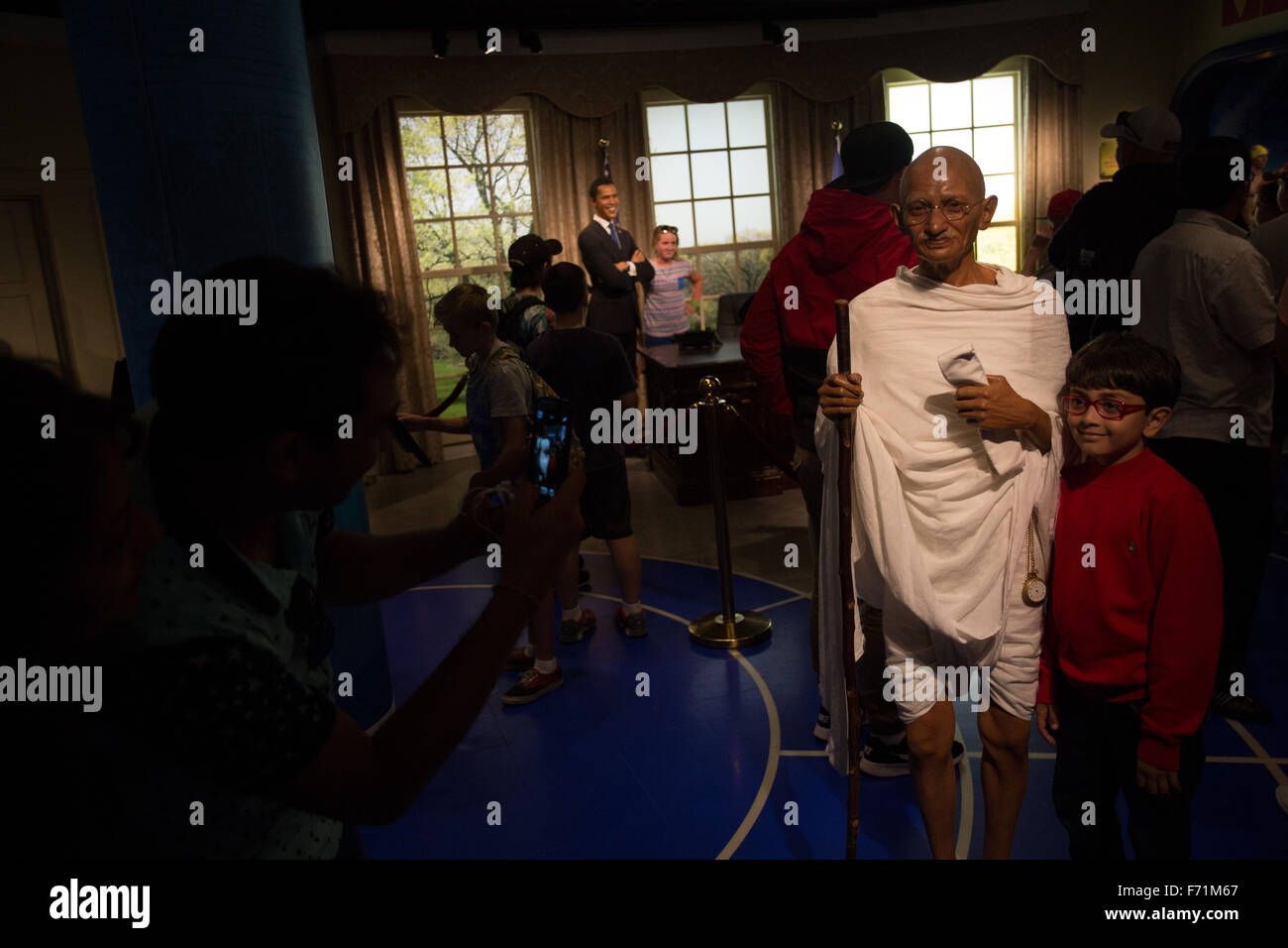 tourist taking picture inside madame tussauds wax figure museum Sydney