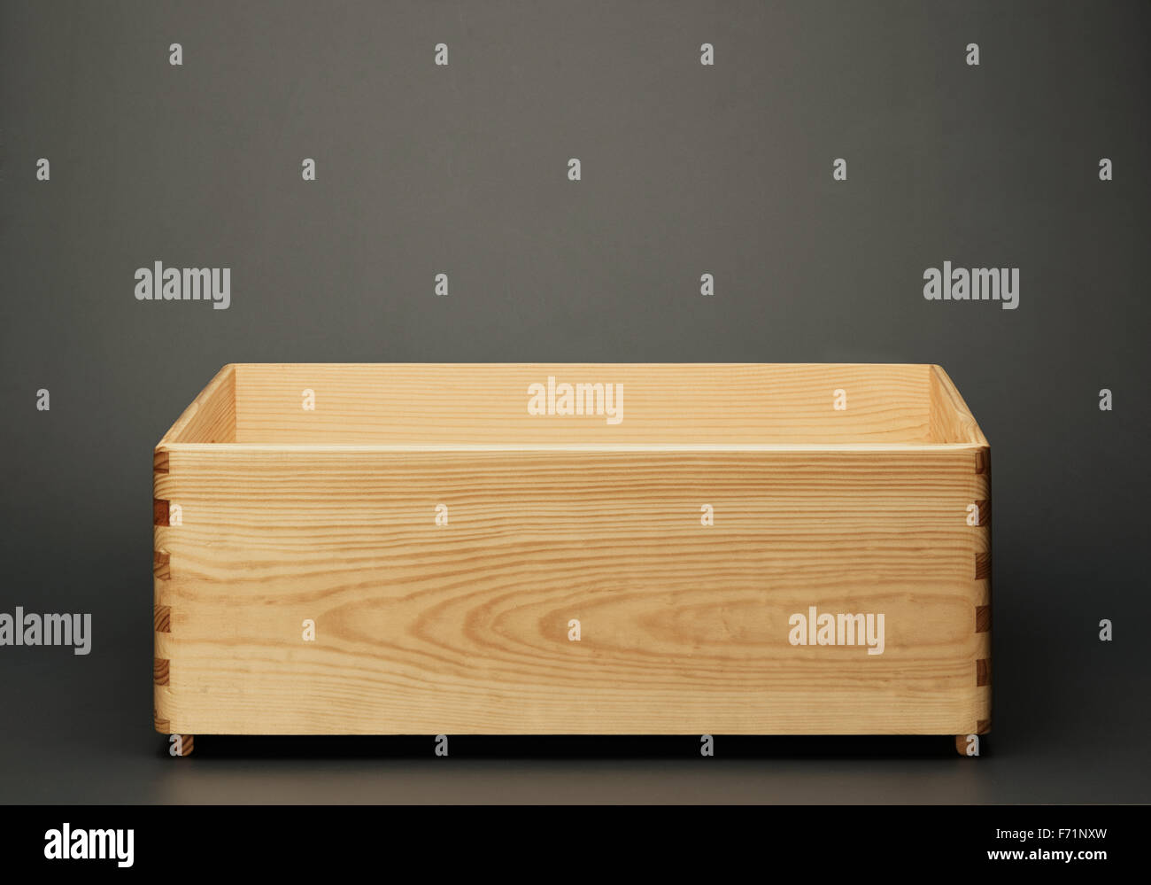Empty wooden box on gray background Stock Photo