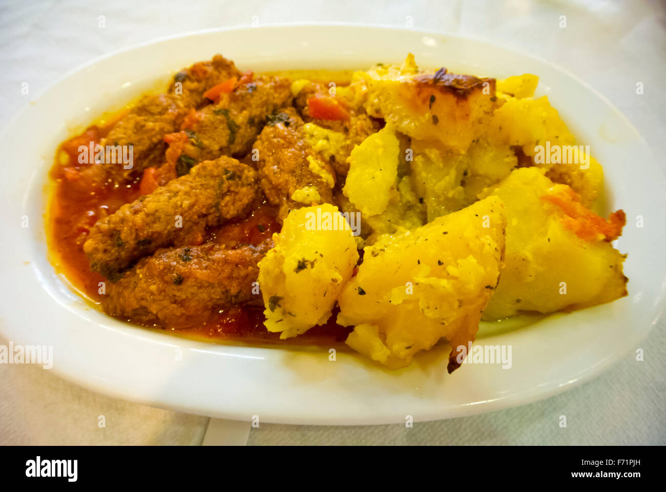 Soutzoukakia, Greek meatballs in tomato sauce, with potatoes, in