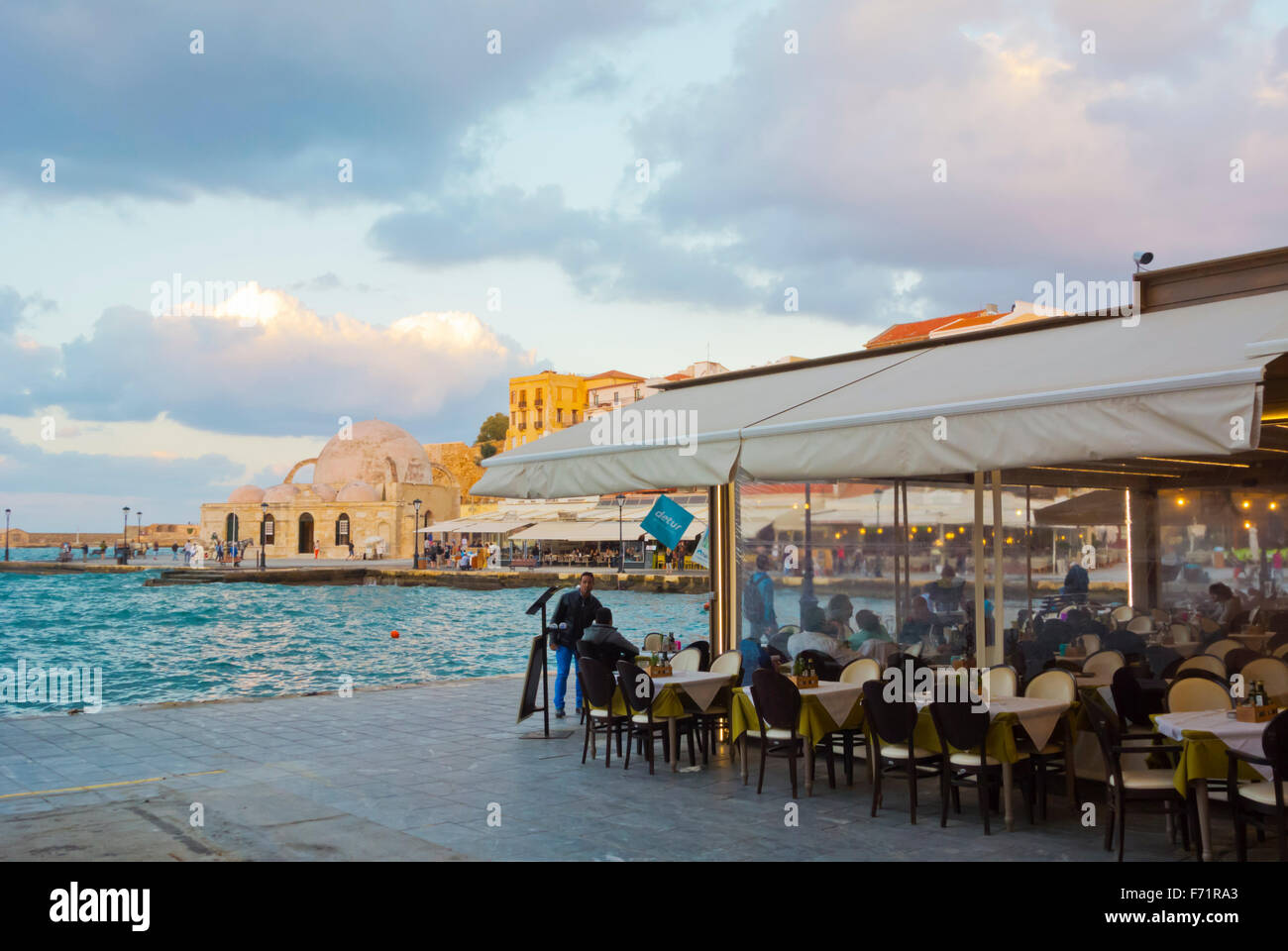Cafe, Akti Kountourioti, Old Venetian port, Chania, Hania, Crete island, Greece Stock Photo