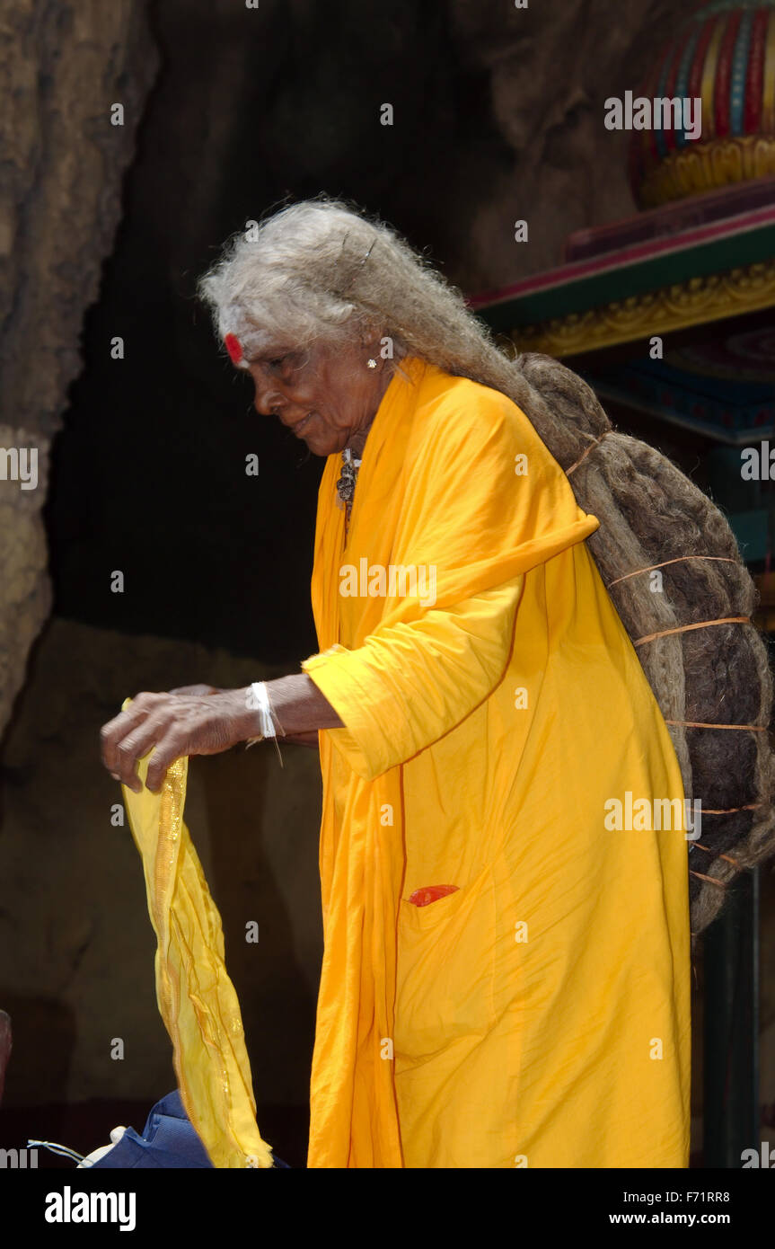 an elderly nun with very long hair in Batu Caves limestone caves and  temples, Kuala Lumpur, Malaysia, Southeast Asia, Asia Stock Photo - Alamy