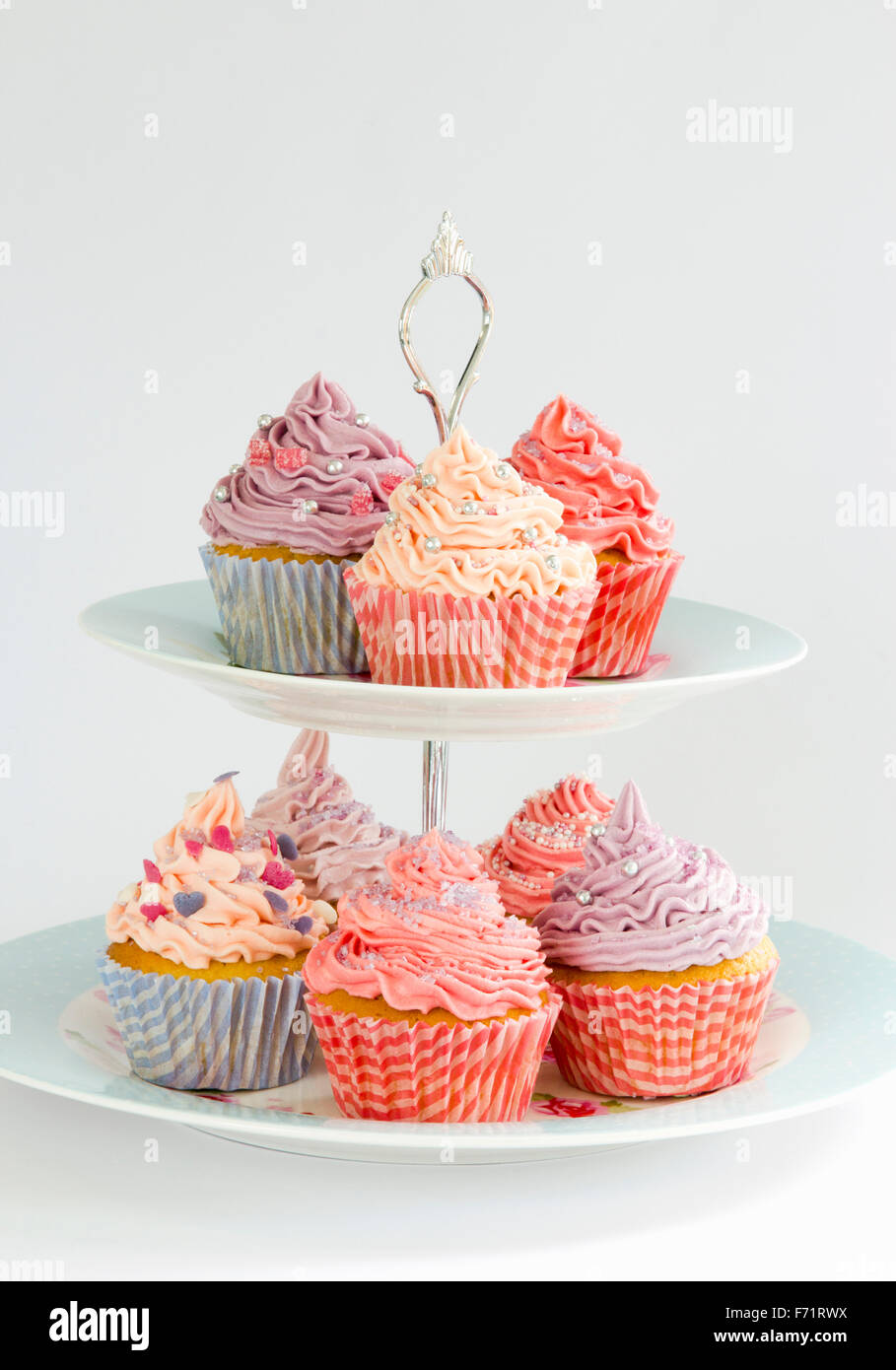 Assorted cupcakes on a tiered stand Stock Photo