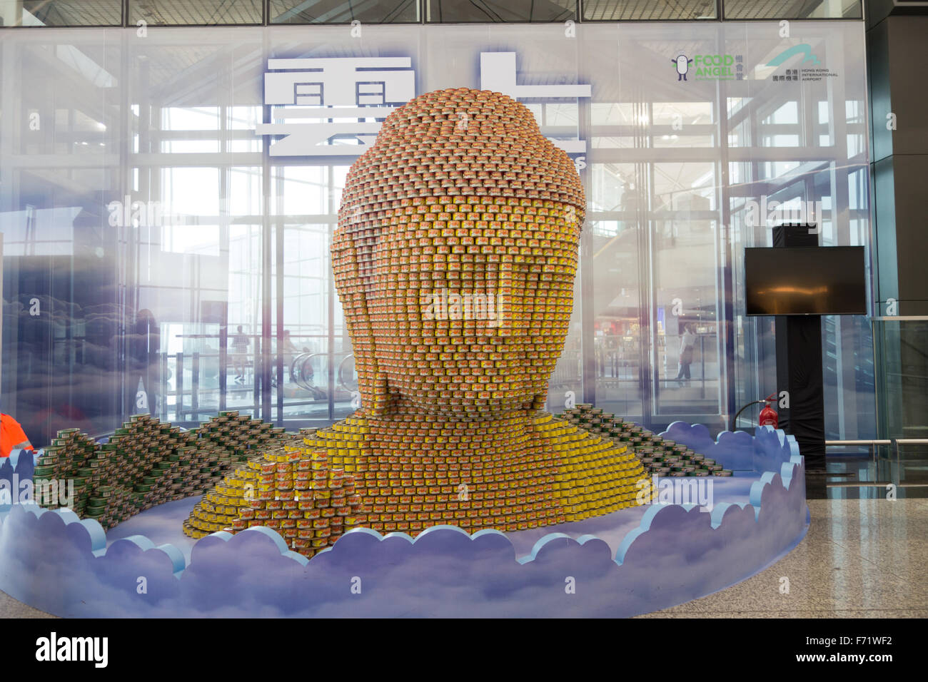 buddha face made with cans hong kong airport Stock Photo