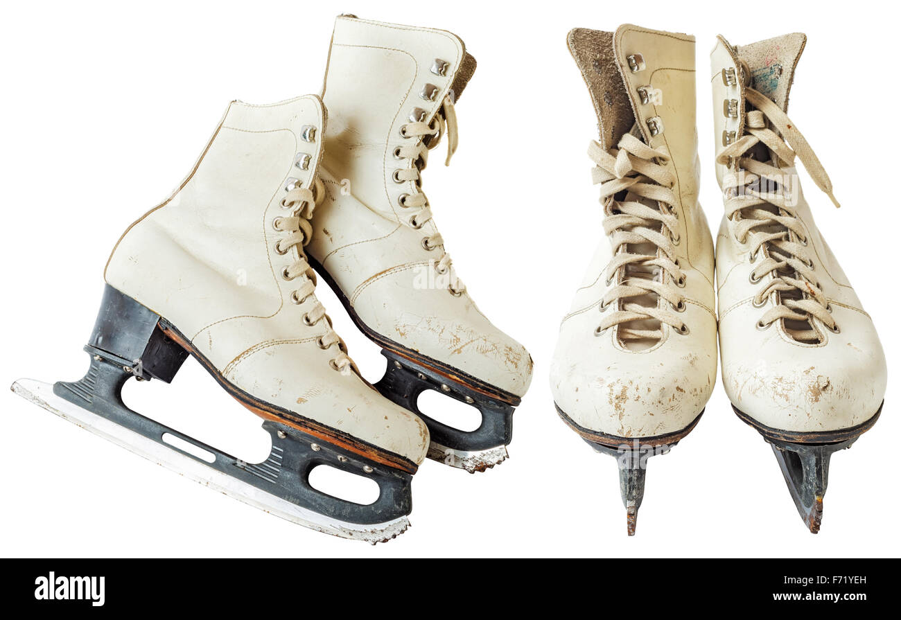 Old white ice skating shoes and blades isolated on white background - stock image. Vintage ice skates. File contains a clipping Stock Photo