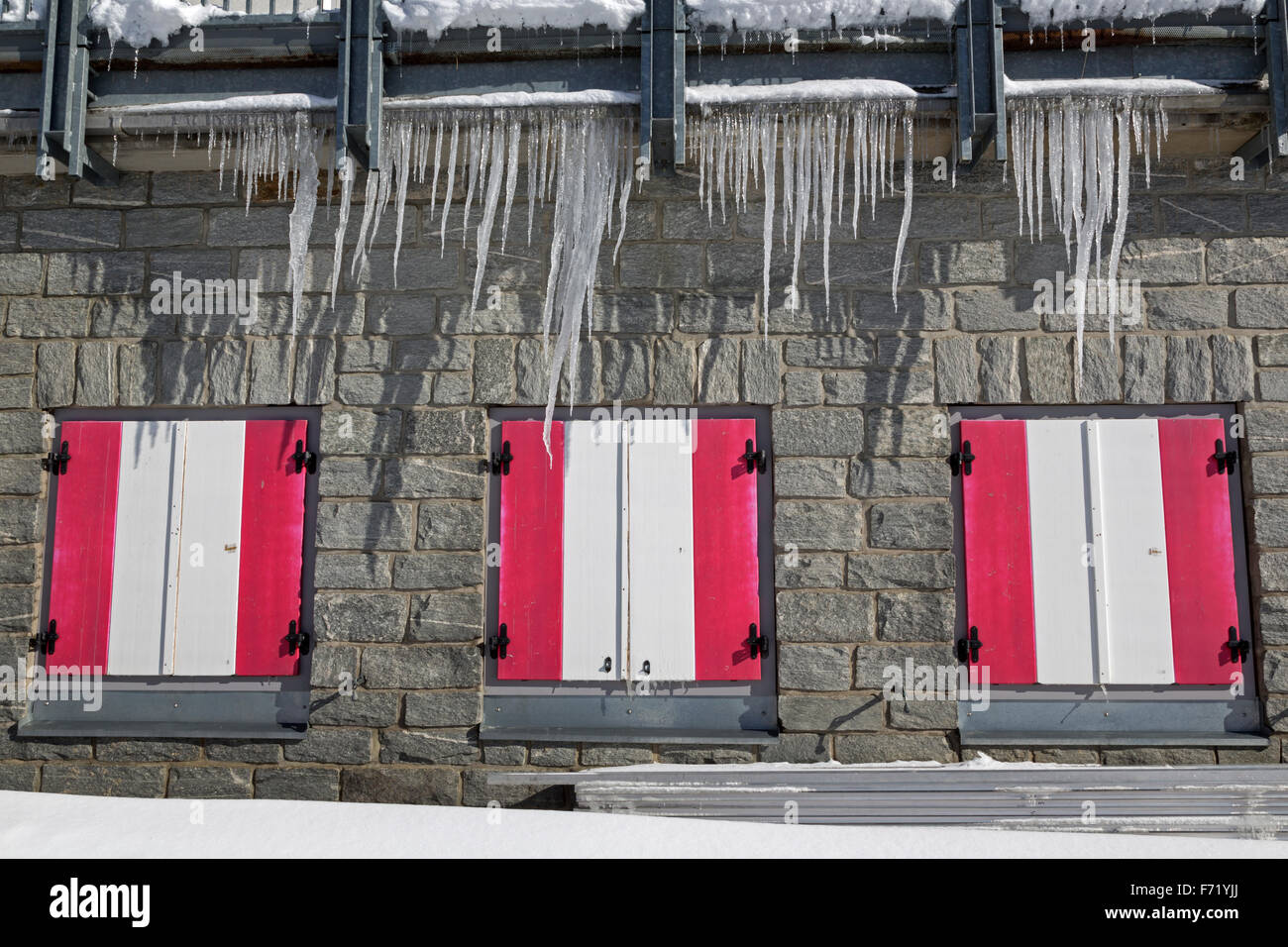 Coloured window shutters with icicles, Hohe Tauern National Park, Tyrol, Austria, Europe Stock Photo