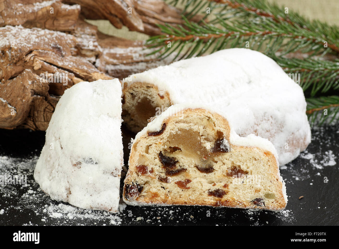 traditional christmas stollen cake with festive background Stock Photo