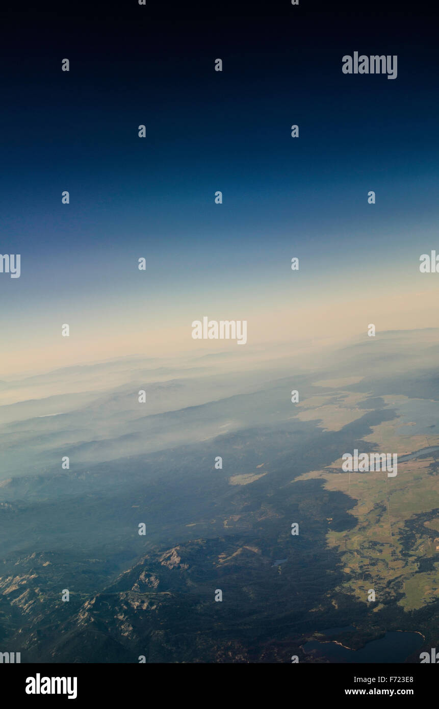 View of Earth And Space With Earth's Circumference In Distance When Flying At 36,000 ft Stock Photo