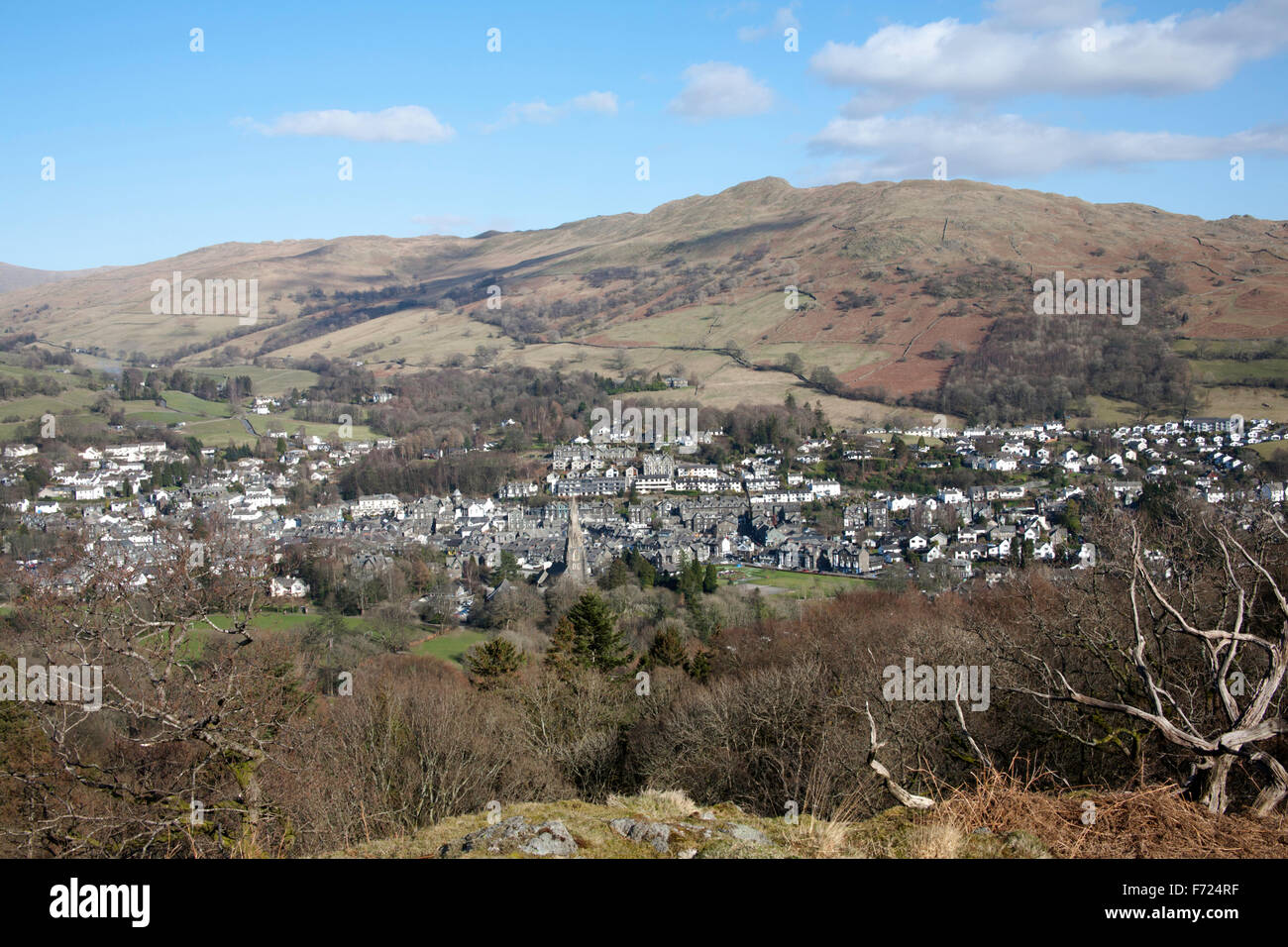 The village of Ambleside lying beneath Wansfell and Wansfell Pike  from Loughrigg Fell Lake District Cumbria England Stock Photo