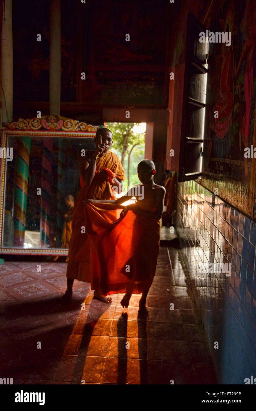 Monks, robes, and late afternoon light at Kampong Phluk, Siem Reap, Cambodia Stock Photo