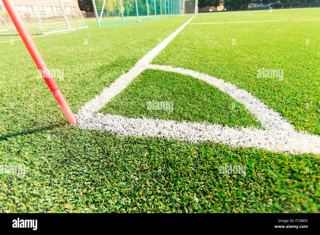 place a corner kick (in football). flag staking this territory Stock