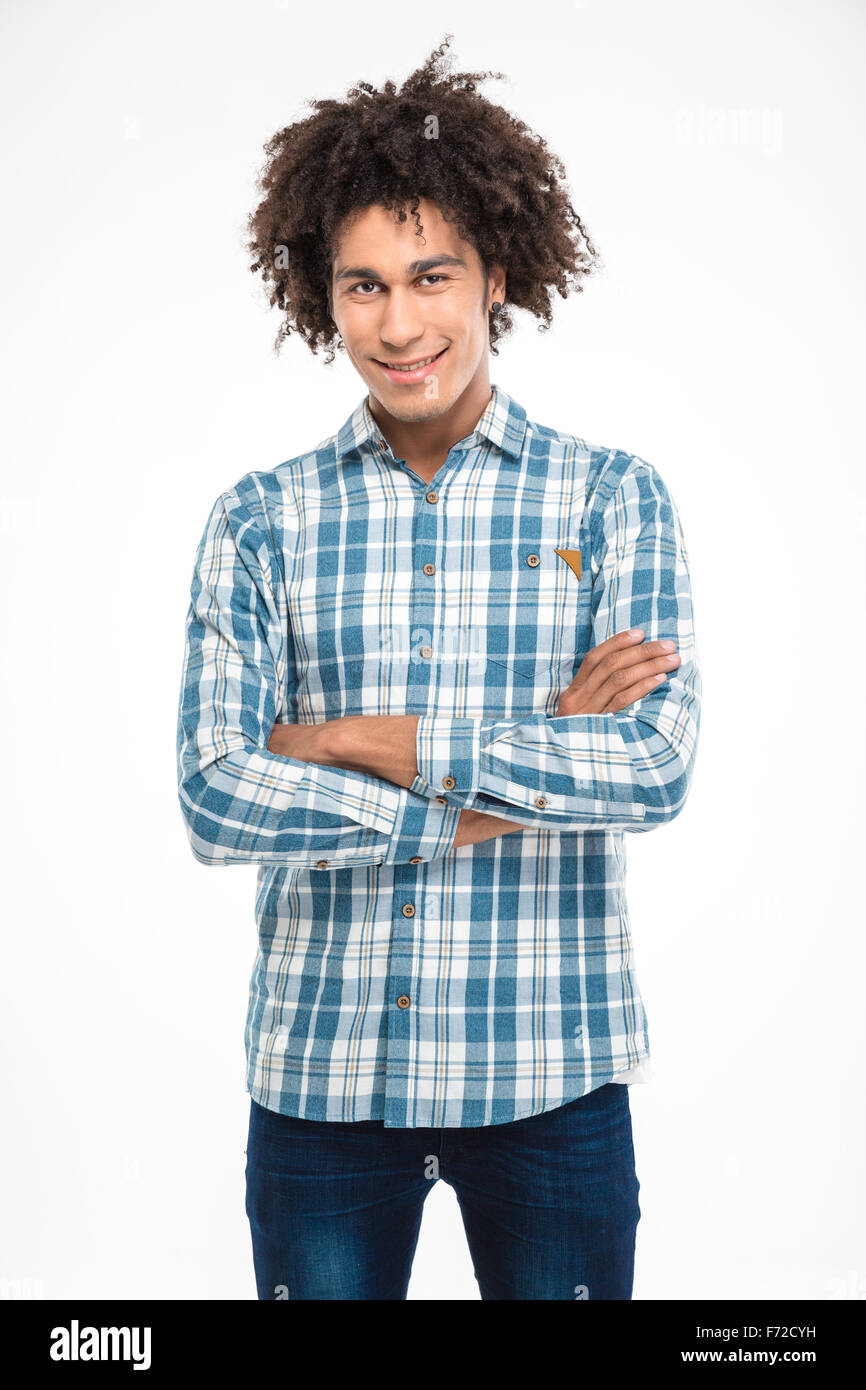 Portrait of a happy afro american man standing with arms folded and ...