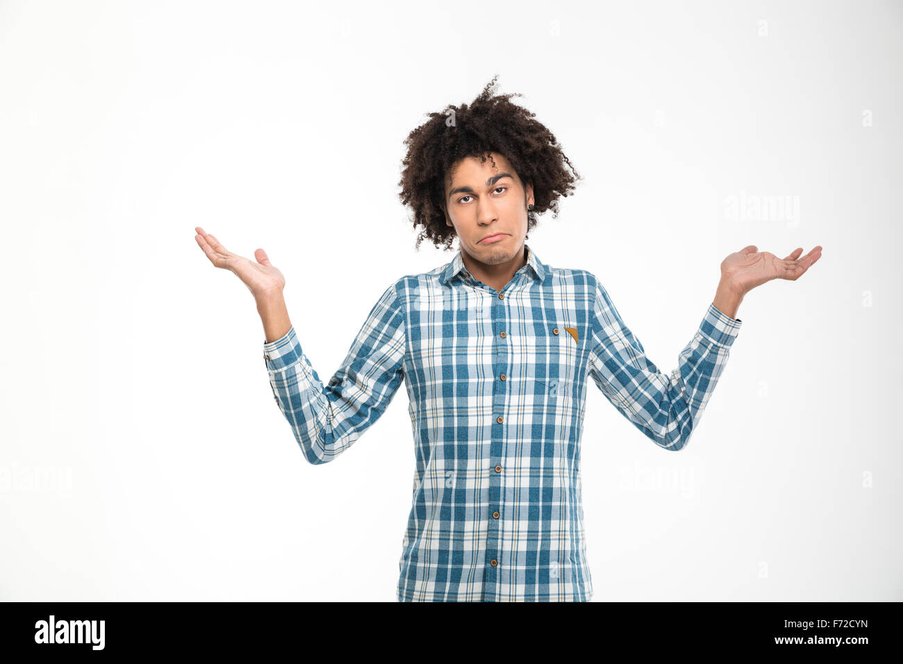 Portrait of a young afro american man shrugging shoulders isolated on a white backround Stock Photo