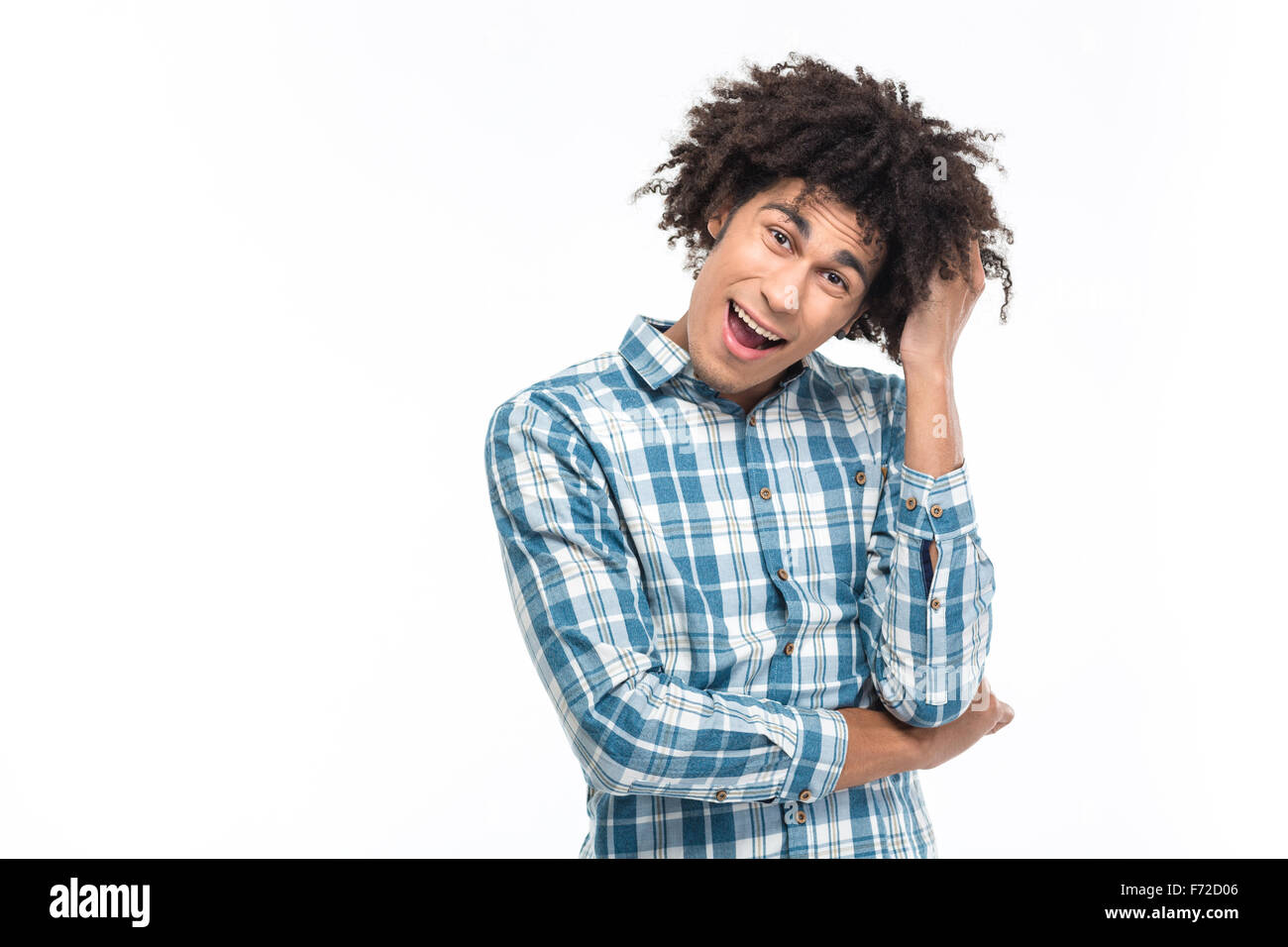Portrait of a cheerful afro american man with curly hair looking at camera isolated on a white background Stock Photo
