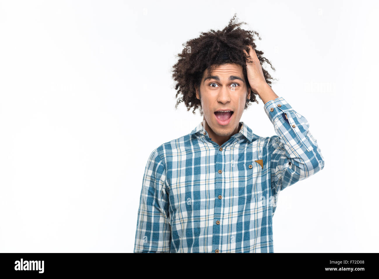 Portrait of amazed afro american man with curly hair looking at camera isolated on a white background Stock Photo
