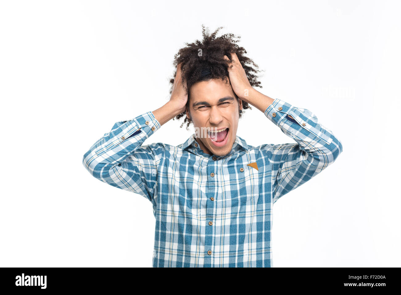 Portrait of a stressed afro american man with curly hair screaming isolated on a white background Stock Photo