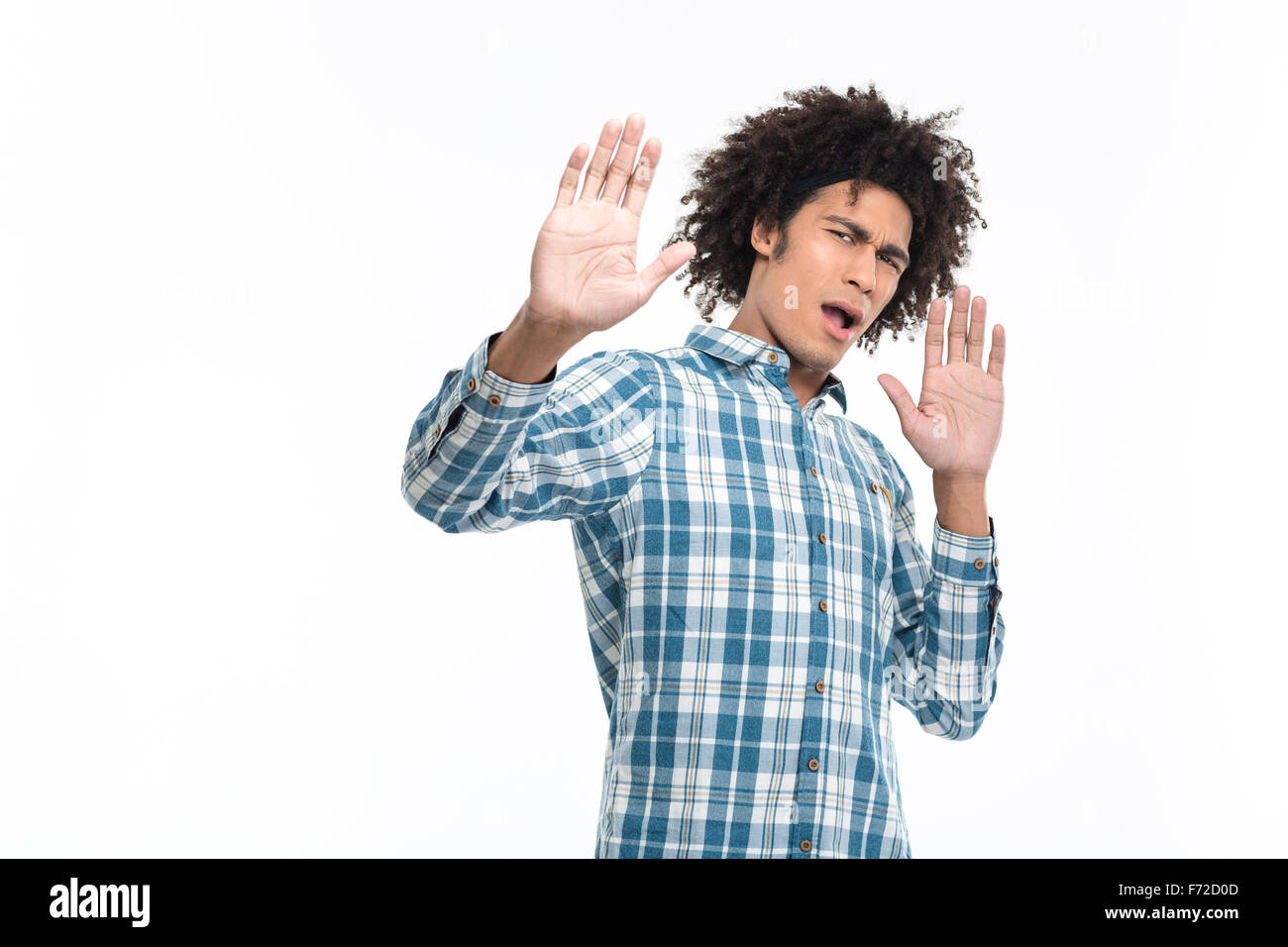 Portrait of a young afro american man with disgust emotion standing isolated on a white background Stock Photo