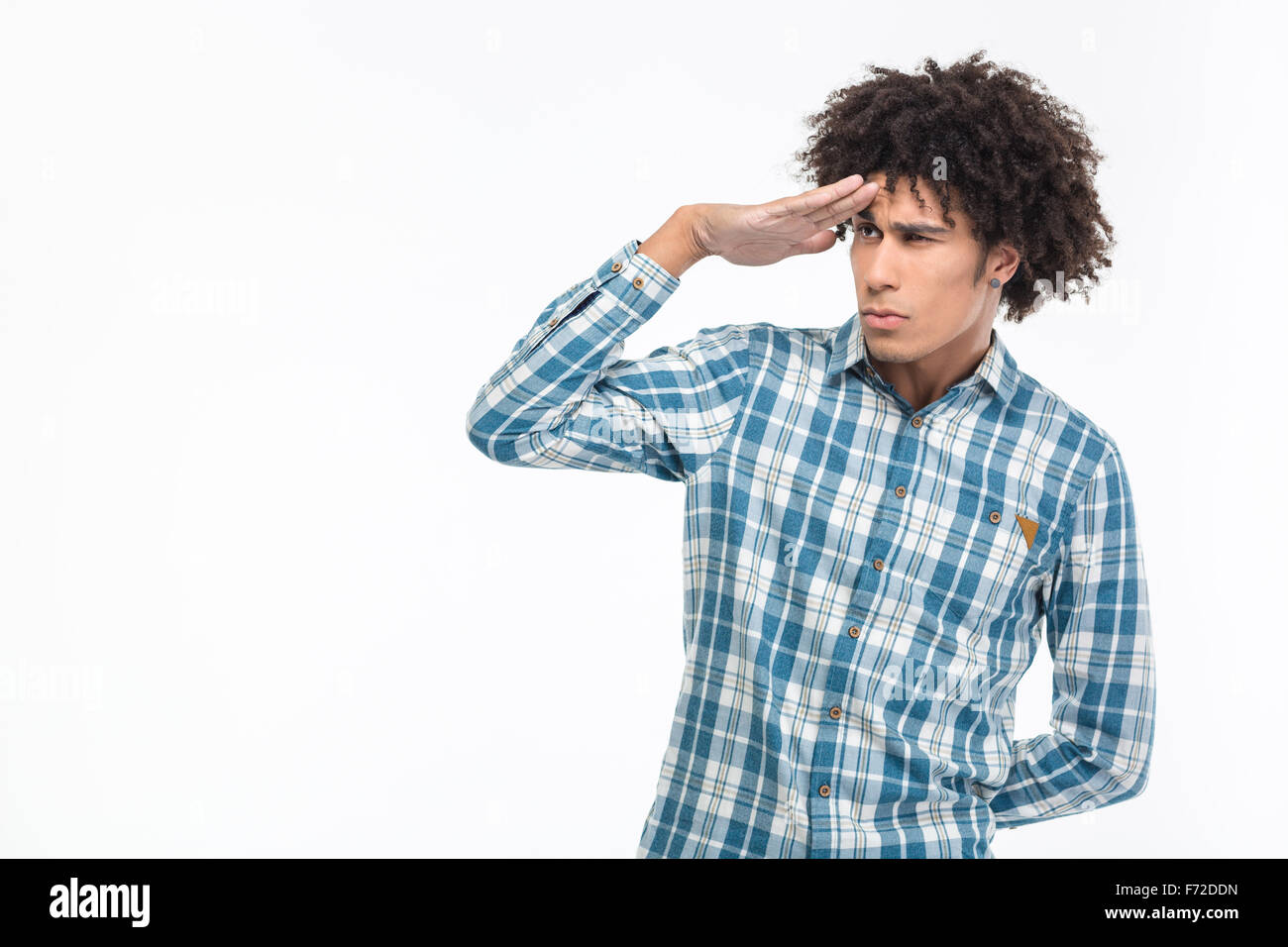 Portrait of a young afro american man with curly hair looking into the distance isolated on a white background Stock Photo