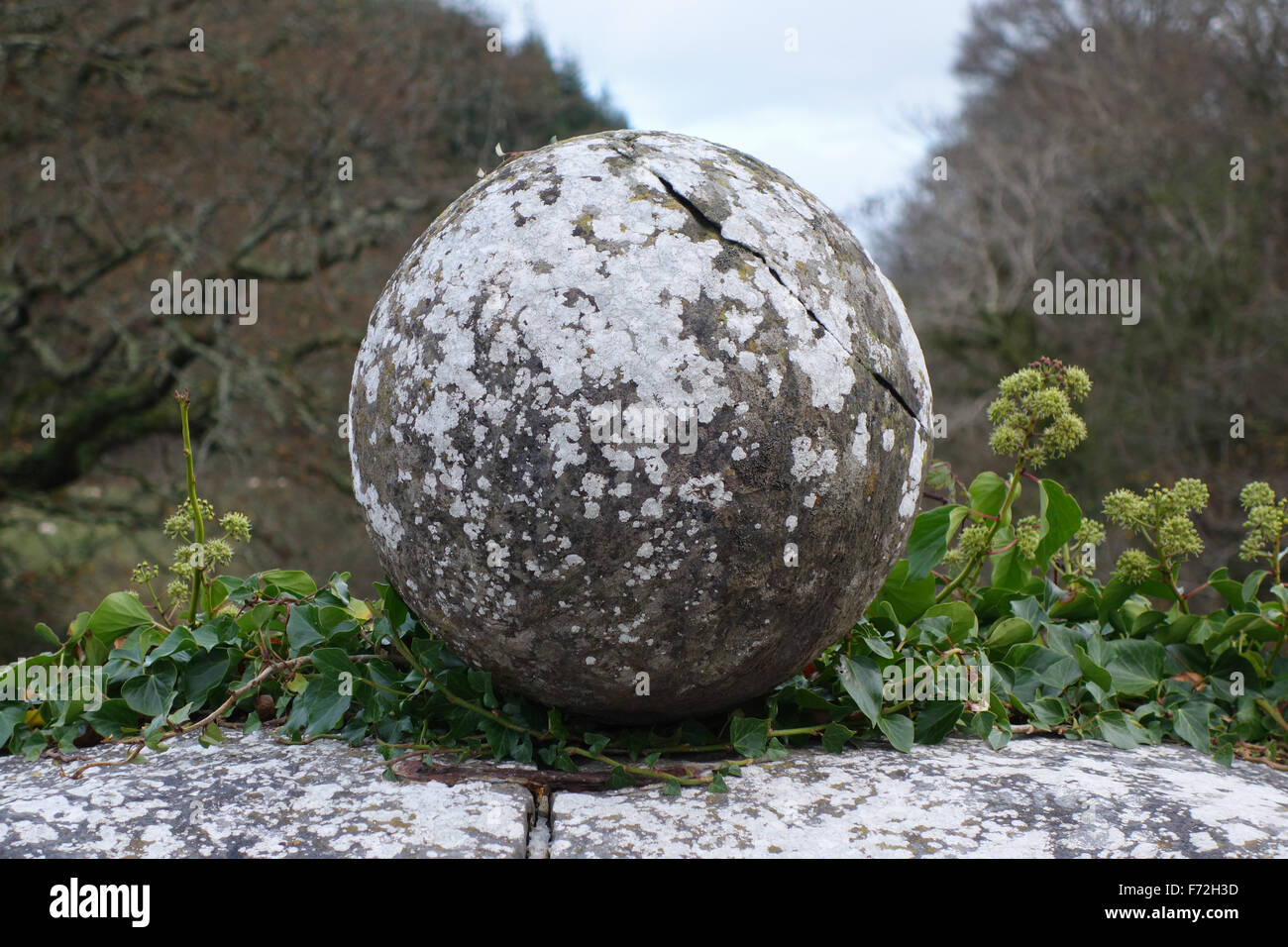 Ornamental orb with lichen and ivy on Blackpool Bridge, which crosses the Eastern Cleddau River at Blackpool Mill, near Canaston Stock Photo