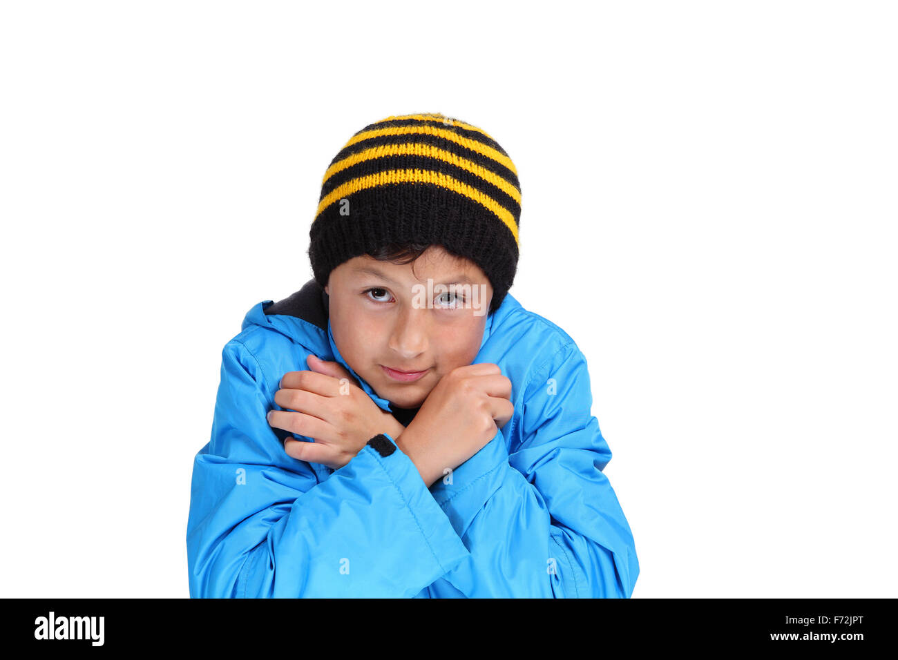 Young boy dressed up for winter - isolated on white Stock Photo