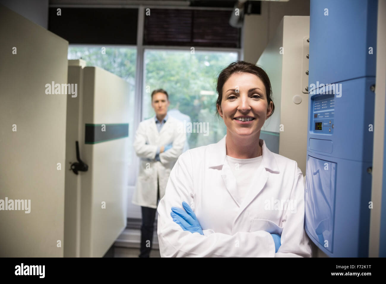 Two scientists smiling at camera Stock Photo