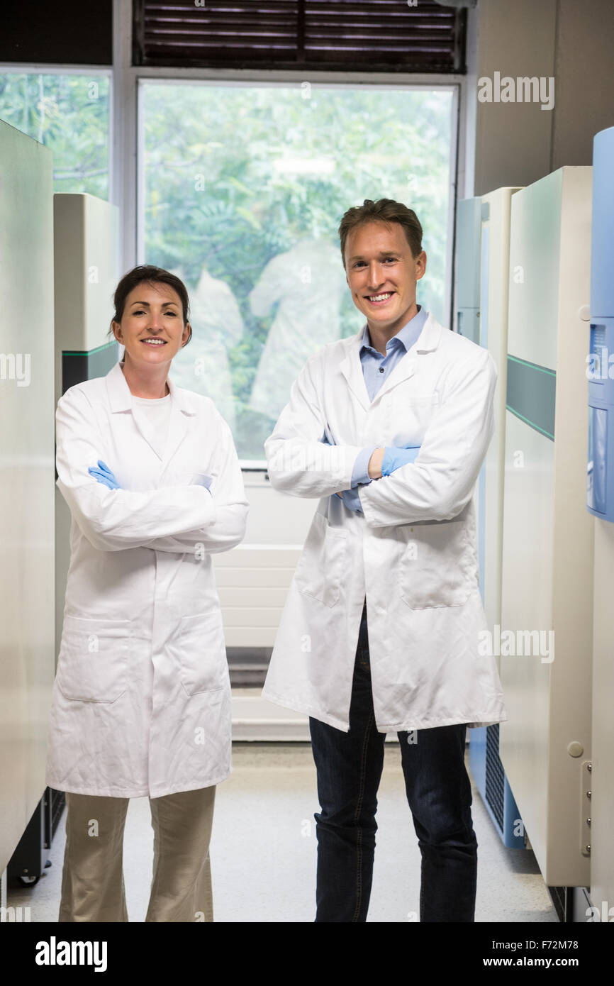 Two scientists smiling at camera Stock Photo