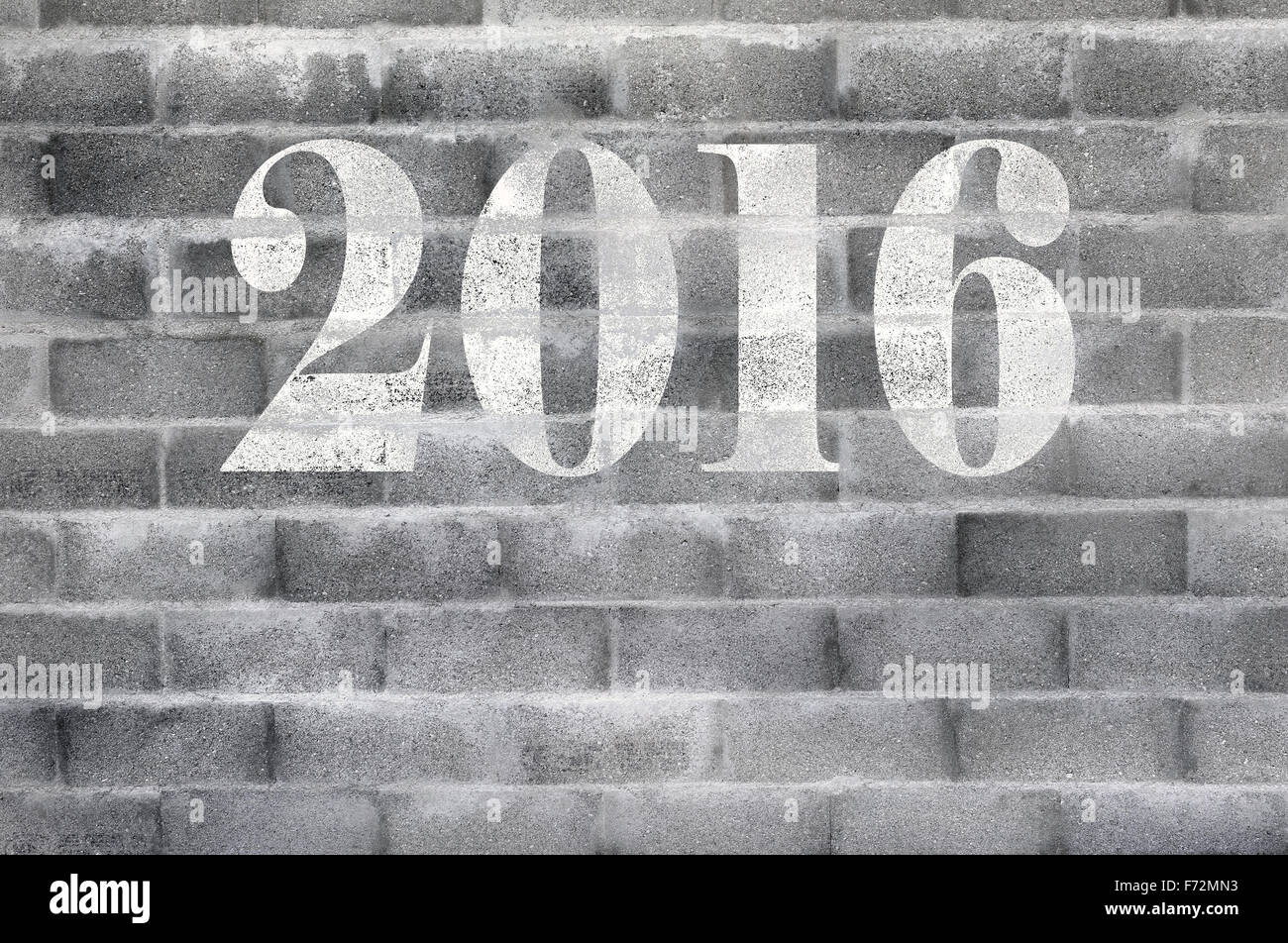 white 2016 on textured cinder block wall Stock Photo