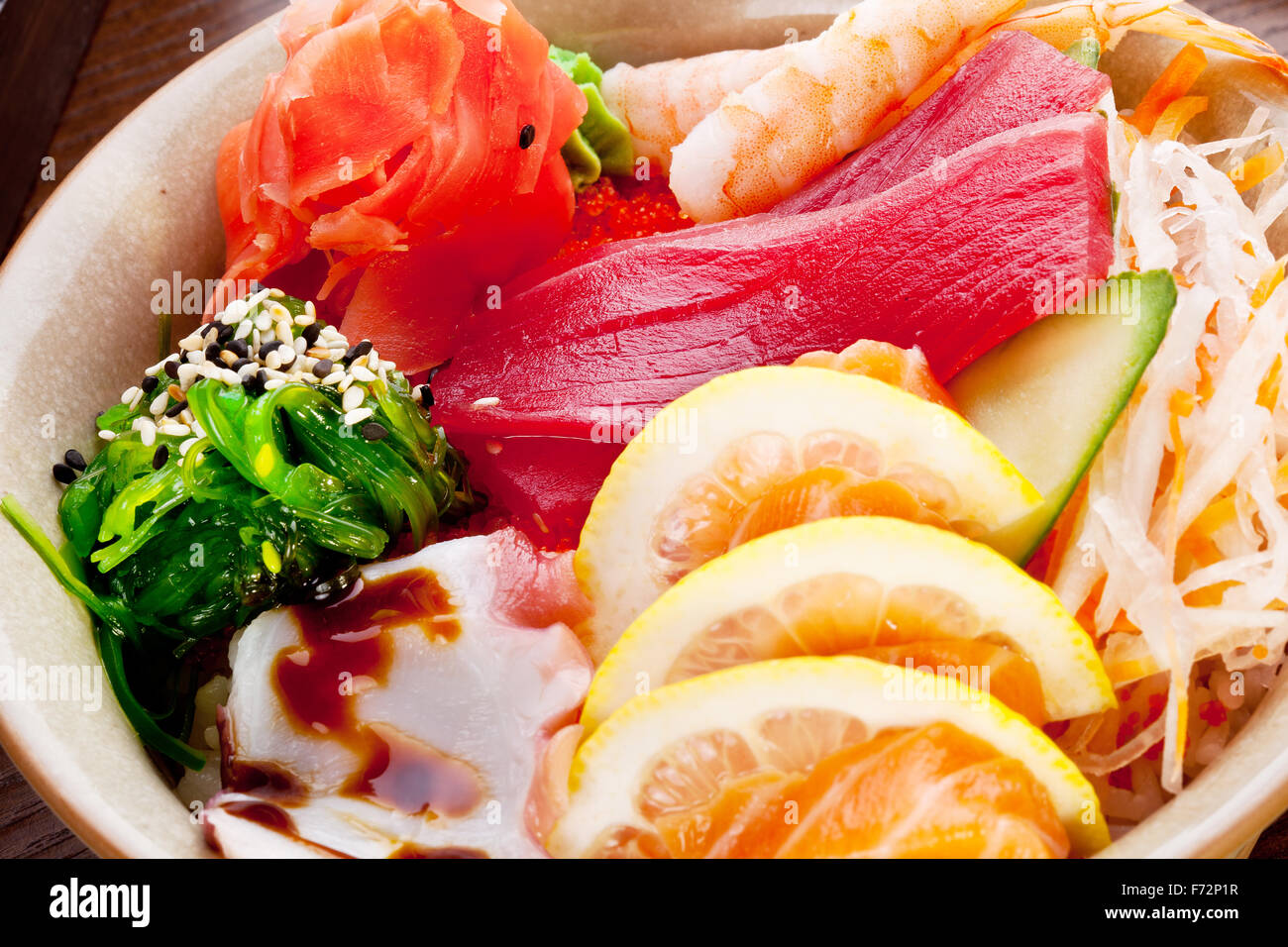 Traditional Japanese food salad with raw seafood and citrus fruits