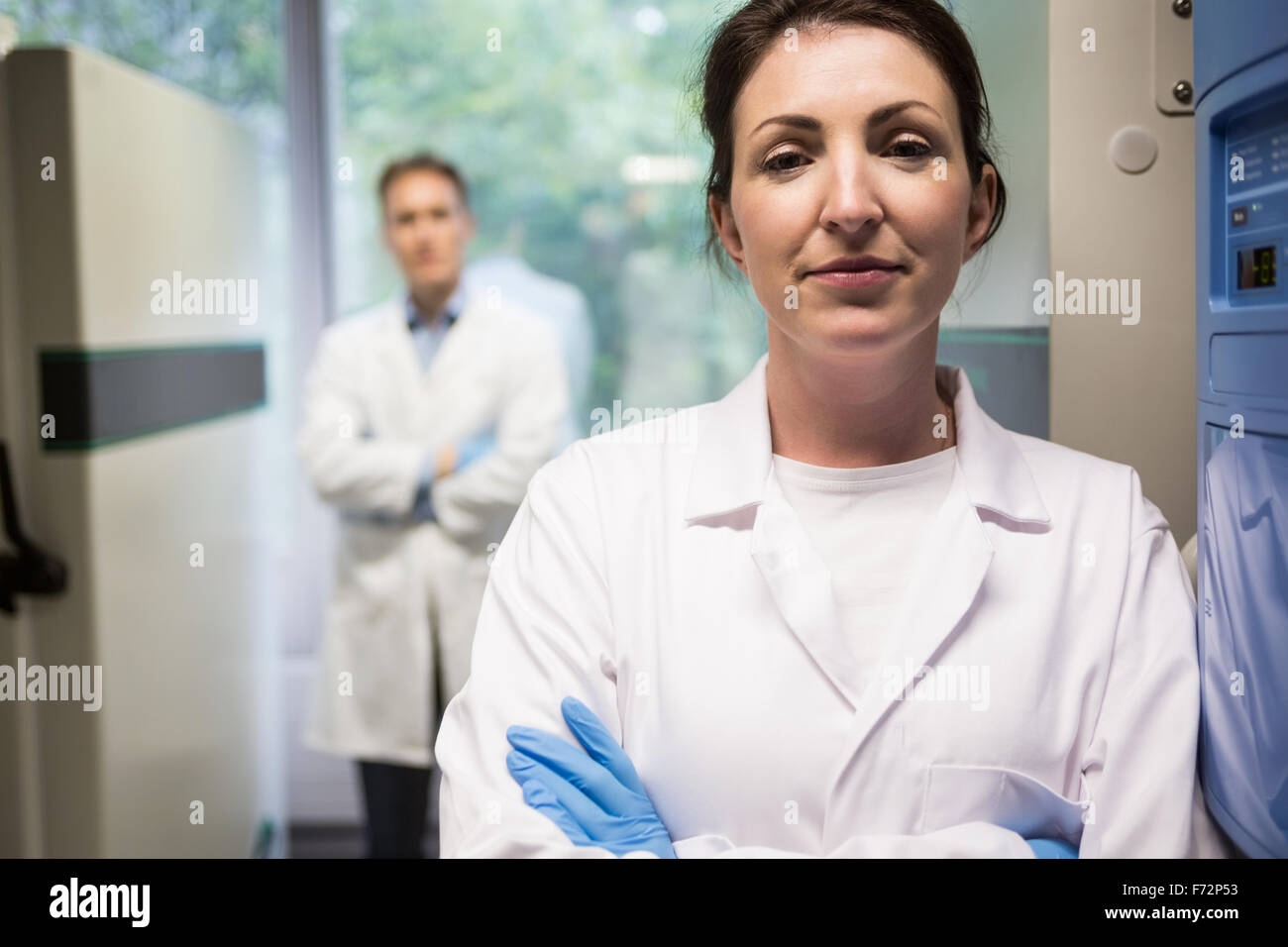 Two scientists smiling at camera Stock Photo