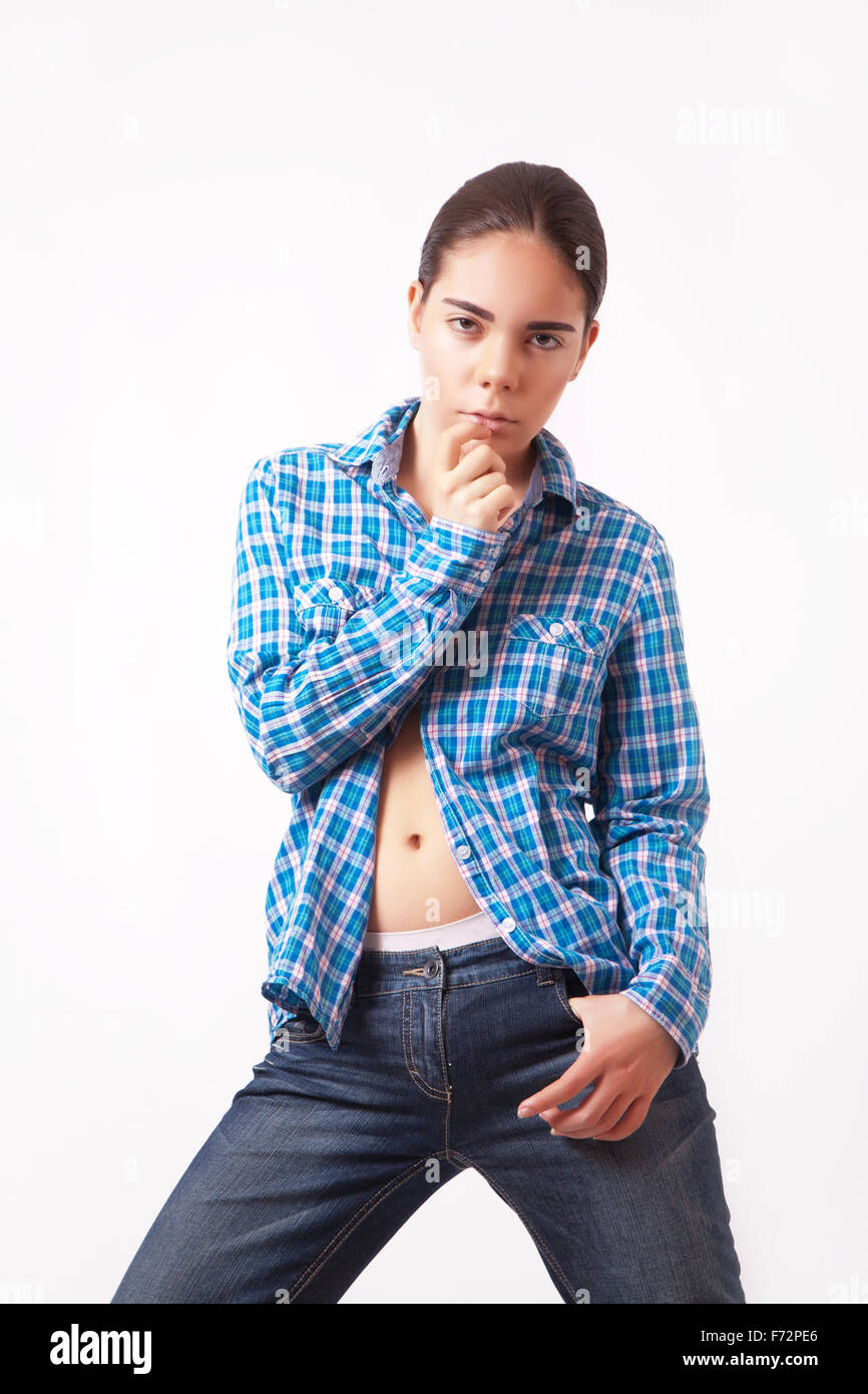 Attractive young woman in a blue shirt and jeans Stock Photo - Alamy