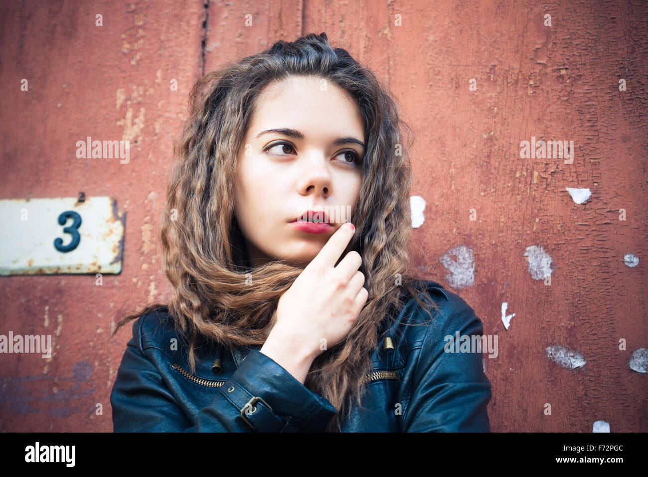 Young woman in leather jacket Stock Photo - Alamy