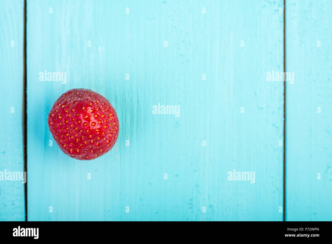 Fresh Red Strawberry On Blue Wood Boards Background Stock Photo - Alamy